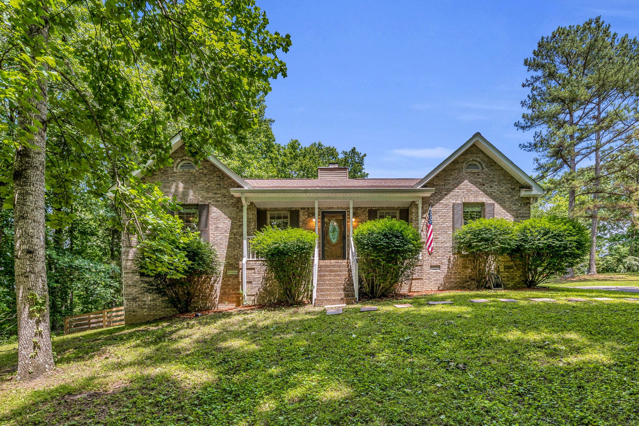 7707 Chester Road Fairview, TN 37062 - Photo 1 of 26 a front view of a house with a yard