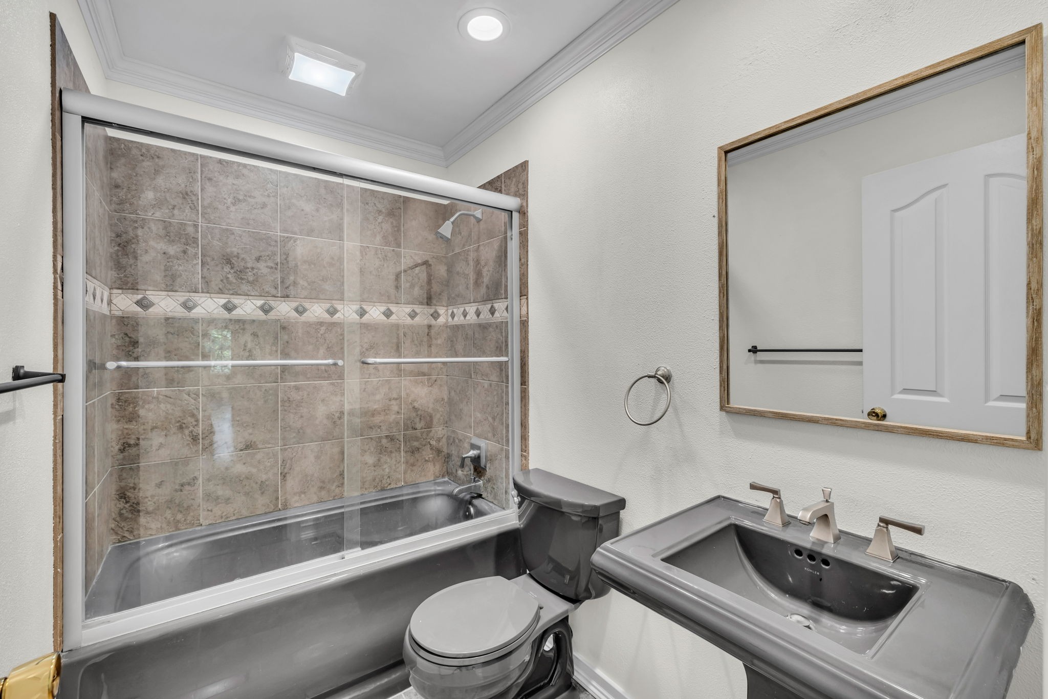 7707 Chester Road Fairview, TN 37062 - Photo 20 of 26 a bathroom with a sink toilet and shower