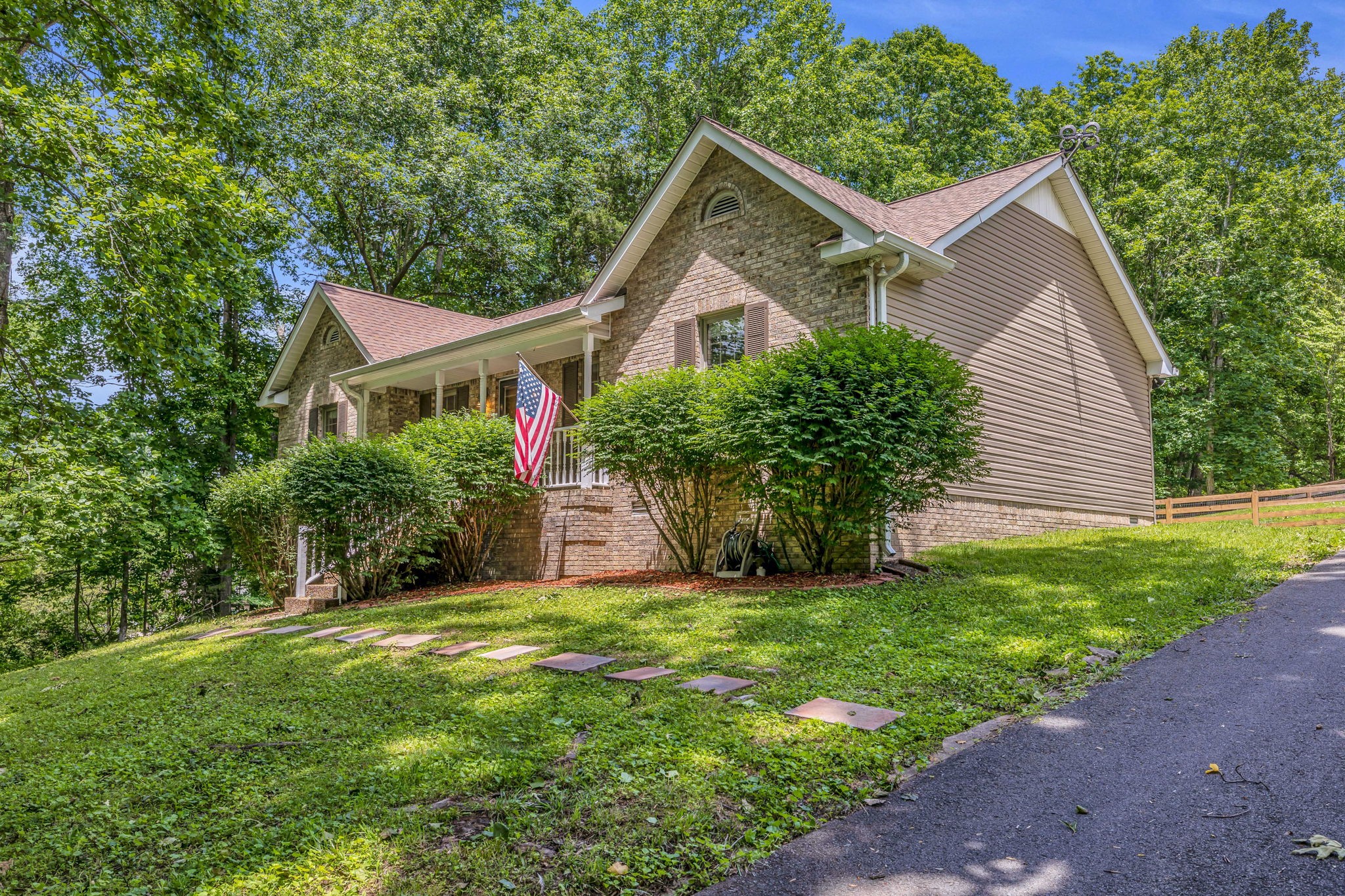 7707 Chester Road Fairview, TN 37062 - Photo 2 of 26 a front view of house with yard and green space