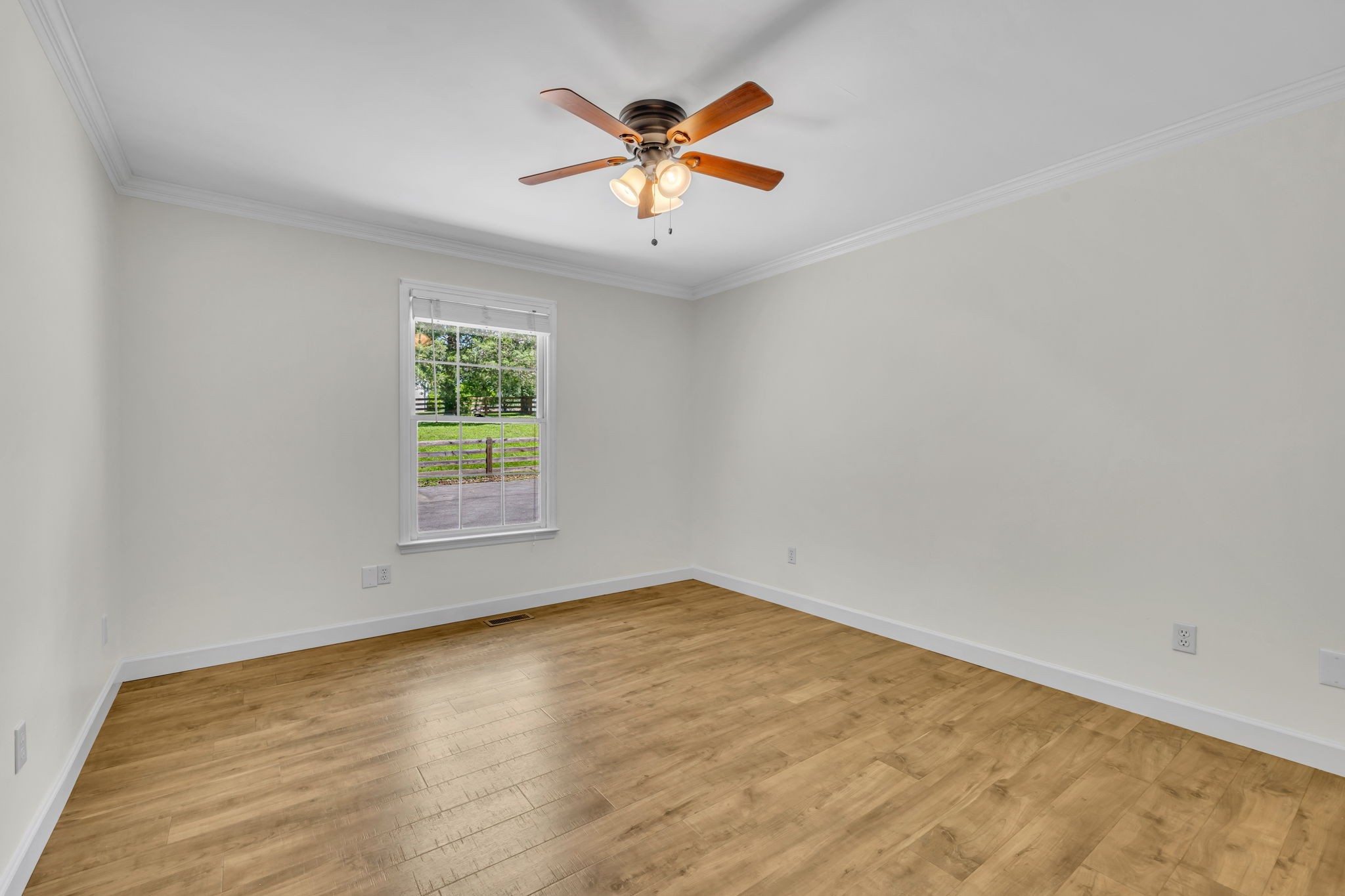 7707 Chester Road Fairview, TN 37062 - Photo 21 of 26 an empty room with ceiling fan and window