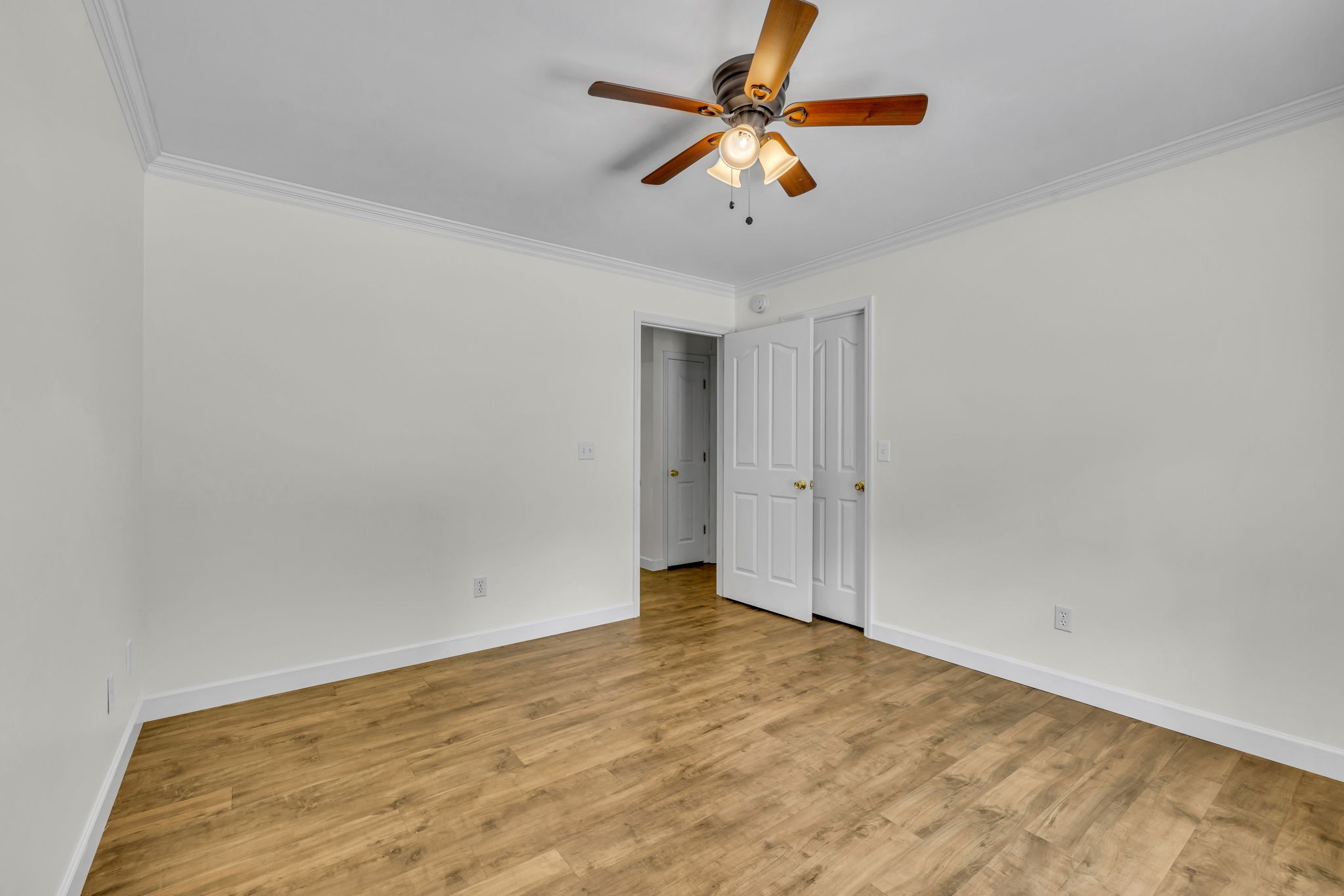 7707 Chester Road Fairview, TN 37062 - Photo 22 of 26 an empty room with a ceiling fan and window