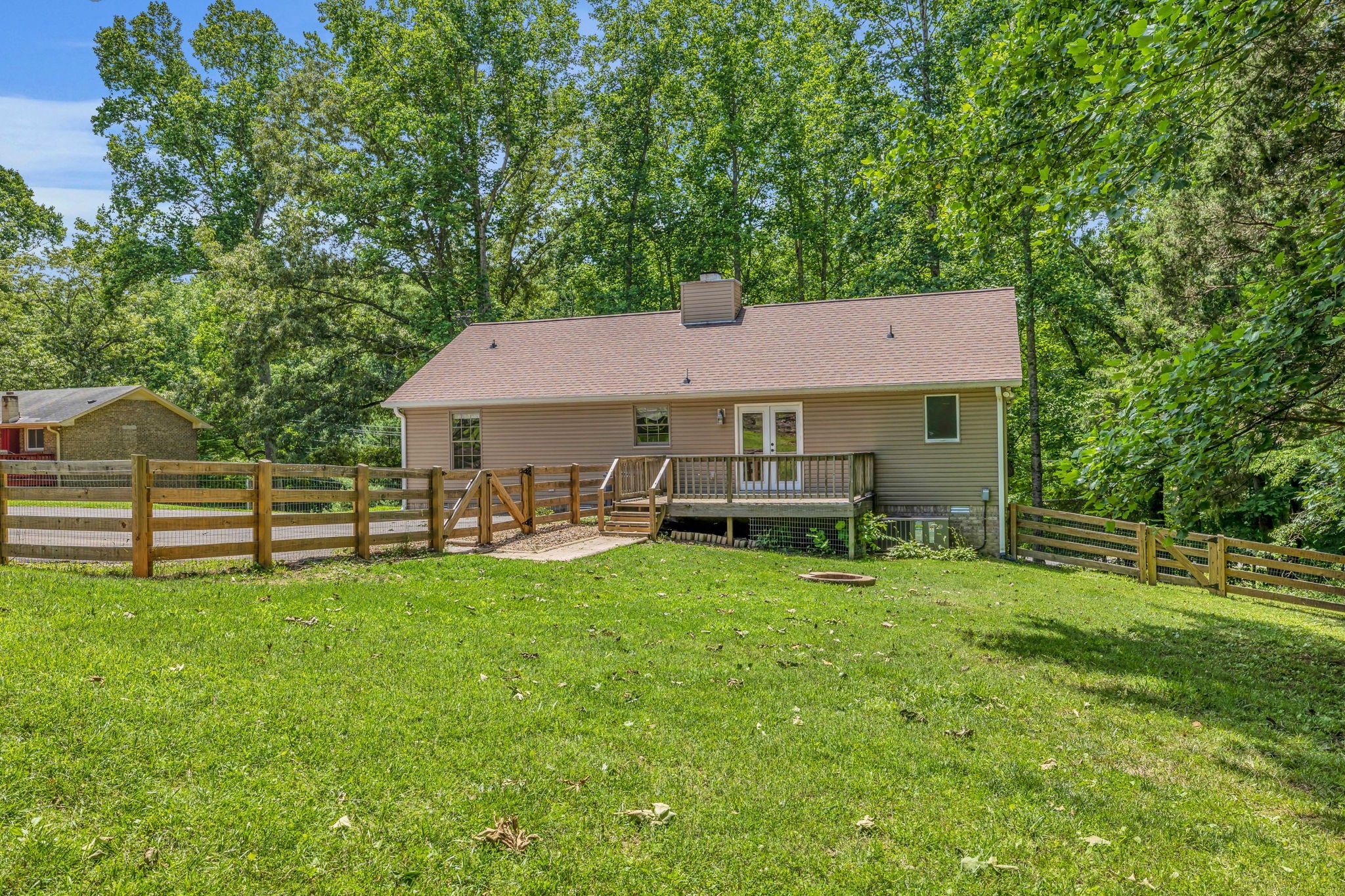 7707 Chester Road Fairview, TN 37062 - Photo 25 of 26 a aerial view of a house with table and chairs under an umbrella