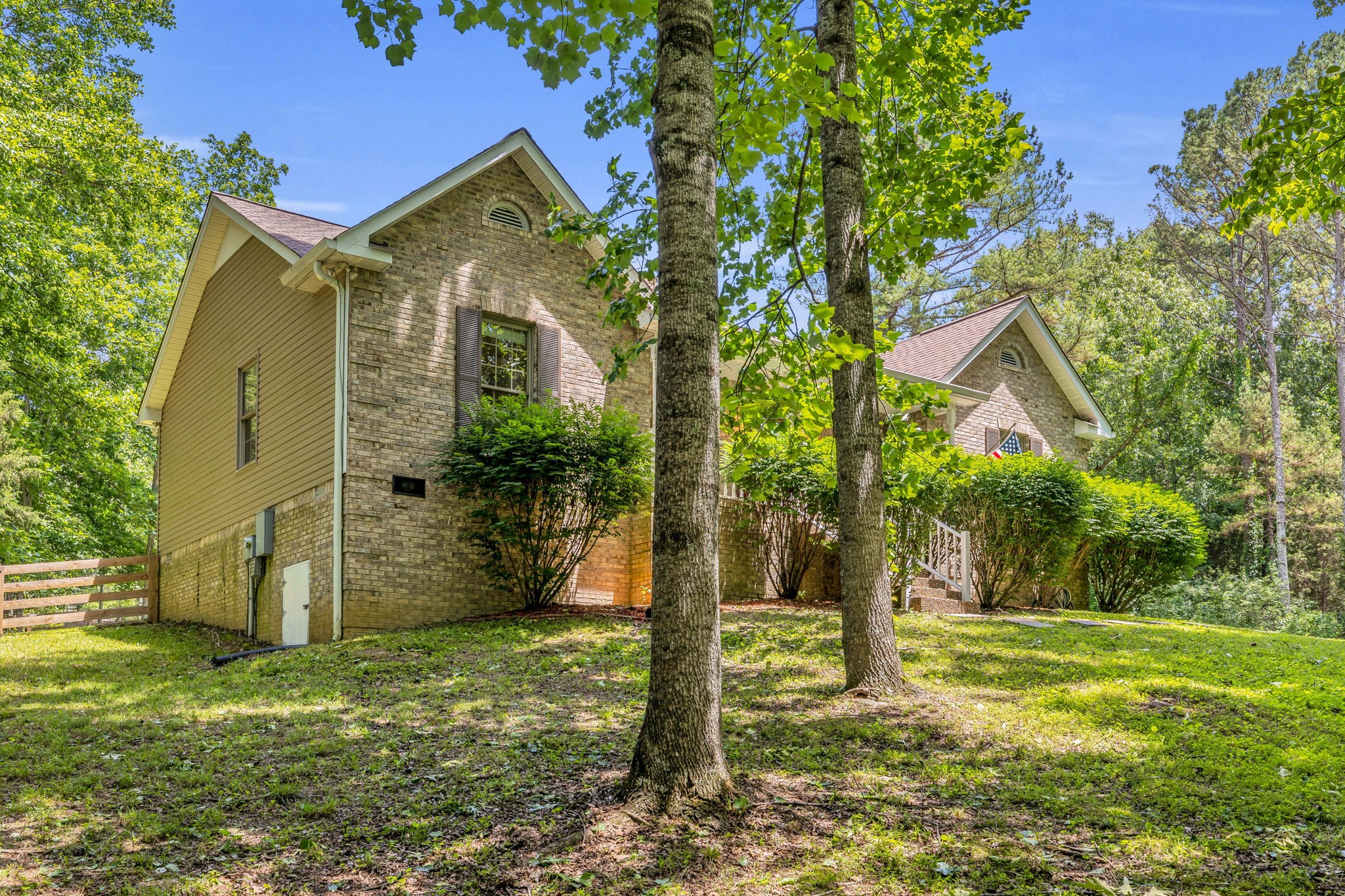 7707 Chester Road Fairview, TN 37062 - Photo 3 of 26 a front view of a house with garden