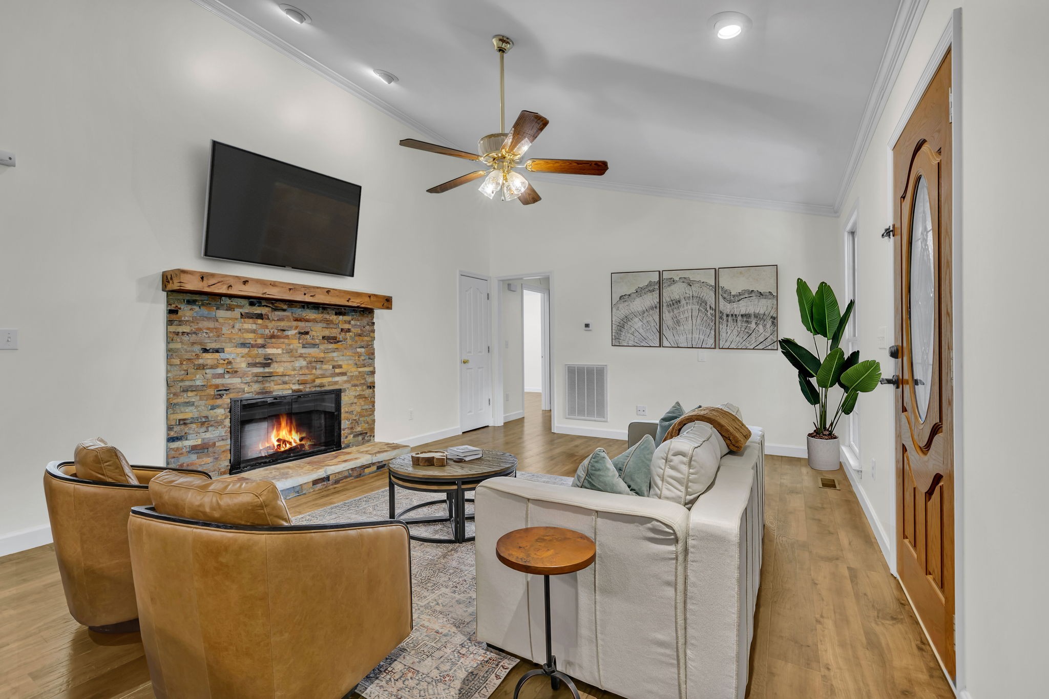 7707 Chester Road Fairview, TN 37062 - Photo 6 of 26 a living room with fireplace furniture and a flat screen tv