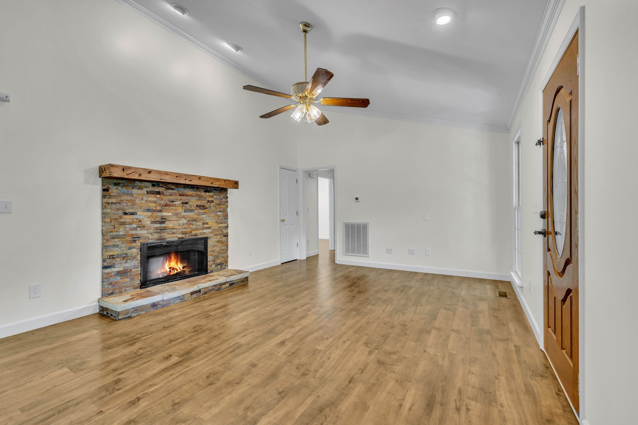7707 Chester Road Fairview, TN 37062 - Photo 7 of 26 wooden floor fireplace and windows in an empty room