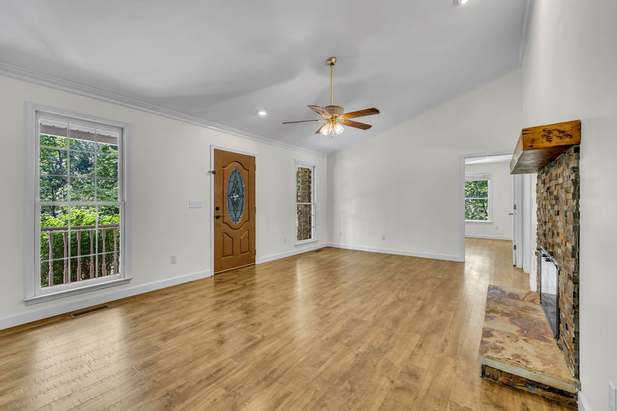 7707 Chester Road Fairview, TN 37062 - Photo 8 of 26 a view of an empty room with glass door and wooden floor