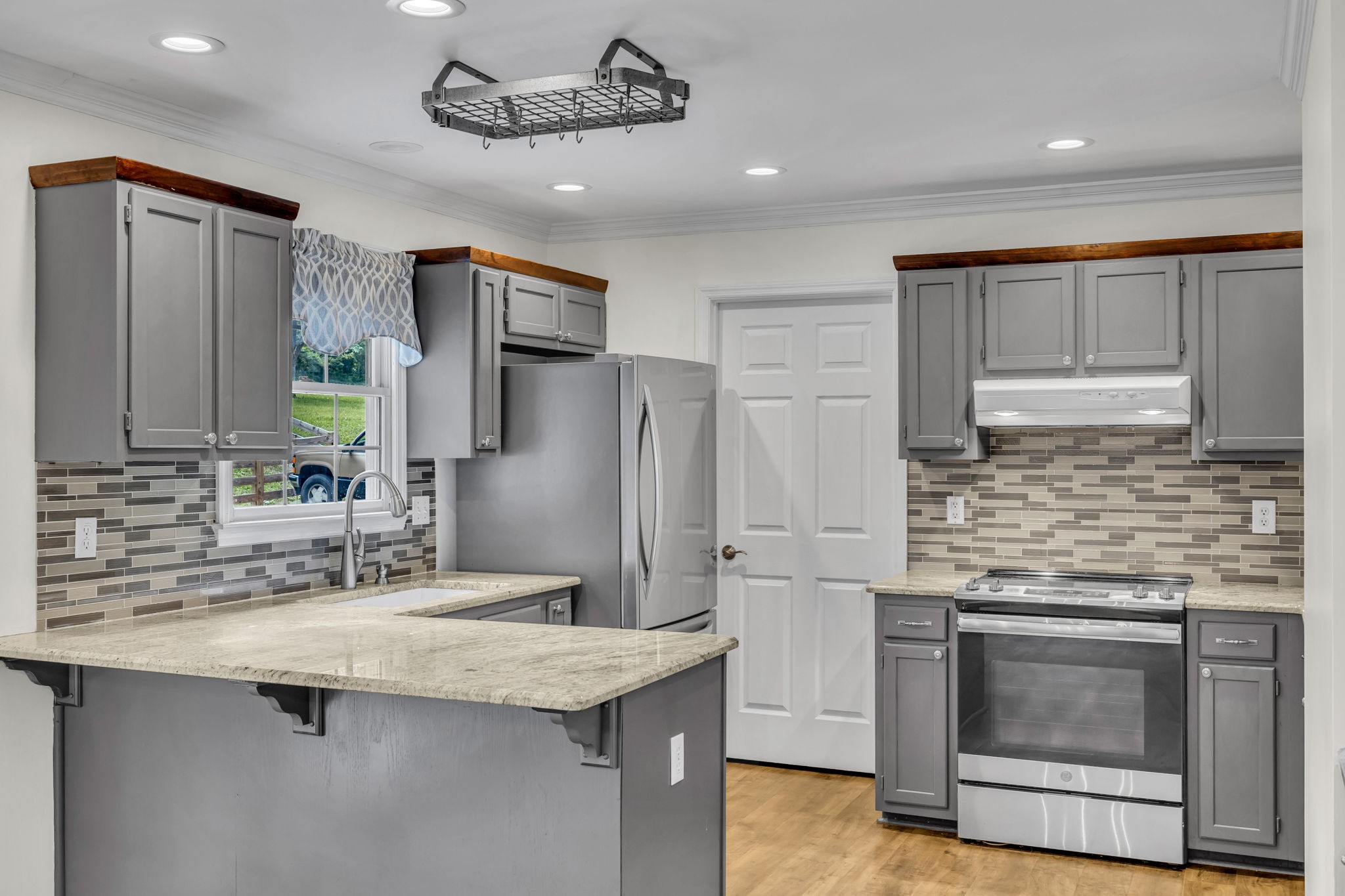 7707 Chester Road Fairview, TN 37062 - Photo 10 of 26 a kitchen with stainless steel appliances granite countertop a sink and refrigerator