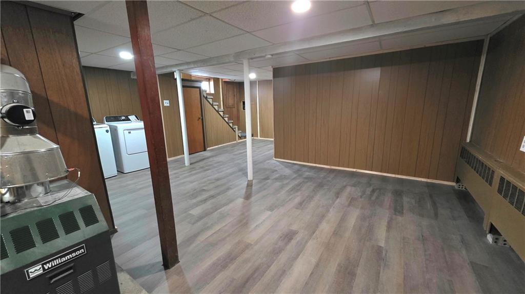 422 Beaver Street Wampum, PA 16157 - Photo 25 of 30 a view of an empty room with wooden floor and a sink
