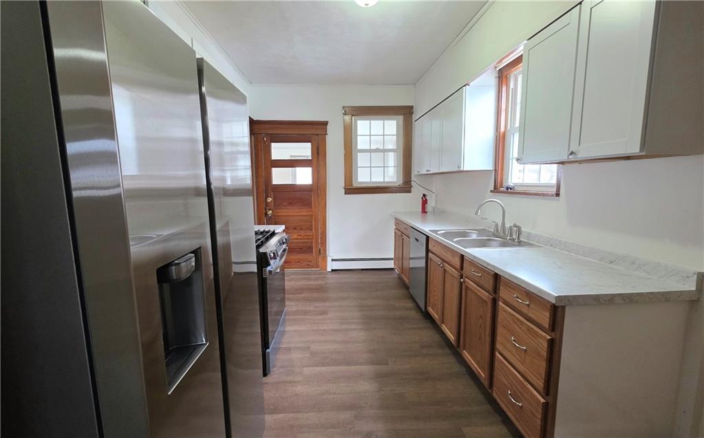 422 Beaver Street Wampum, PA 16157 - Photo 10 of 30 a large kitchen with a sink and refrigerator