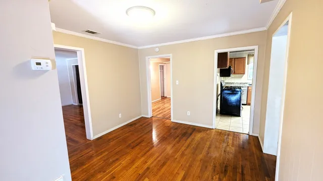 a view of a livingroom with wooden floor
