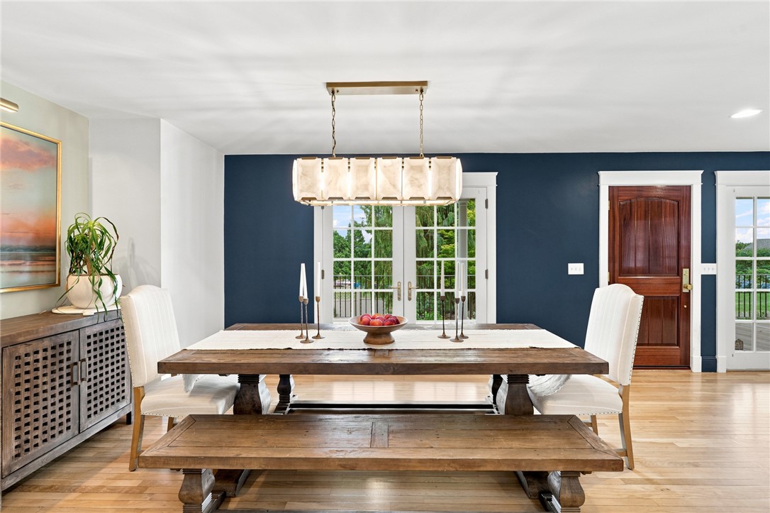 2269 East Main Road Portsmouth, RI 02871 - Photo 21 of 50 Dining room with French doors out to the large East facing porch.