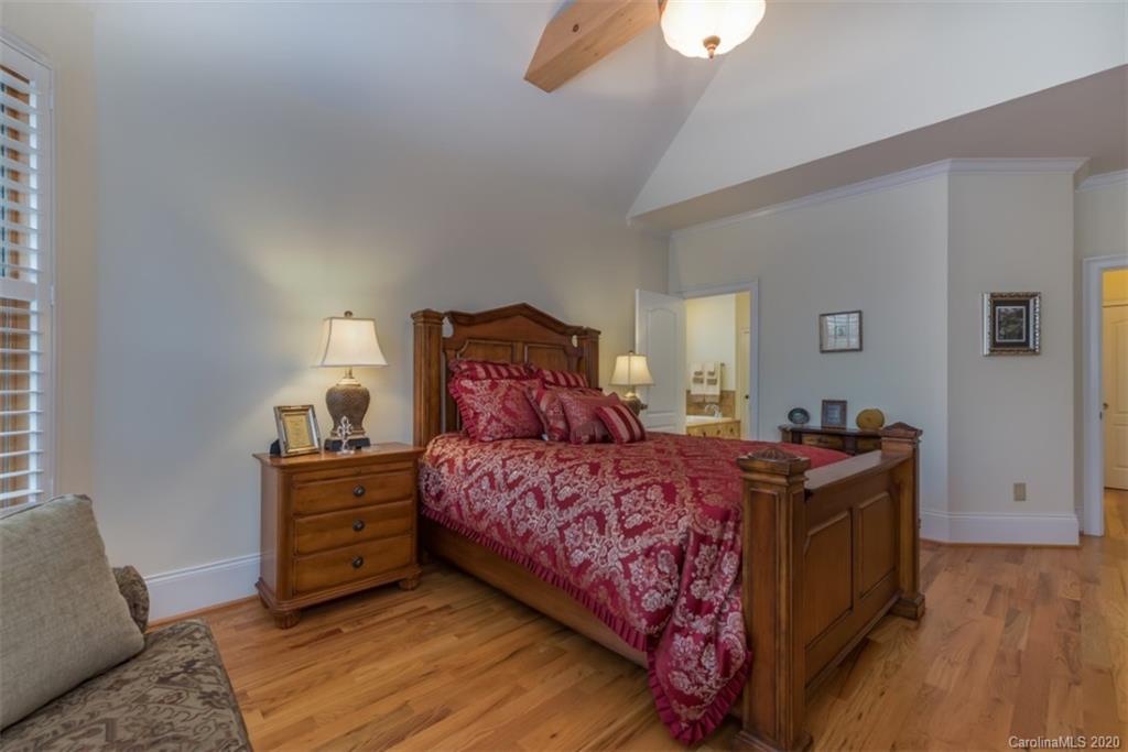 188 Timberlake Road Bostic, NC 28018 - Photo 23 of 48 a bedroom with a bed and a chandelier