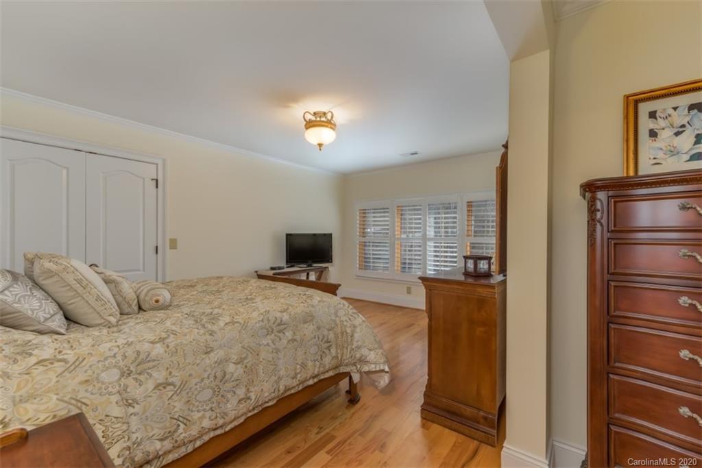 188 Timberlake Road Bostic, NC 28018 - Photo 34 of 48 a bedroom with a bed and a chandelier