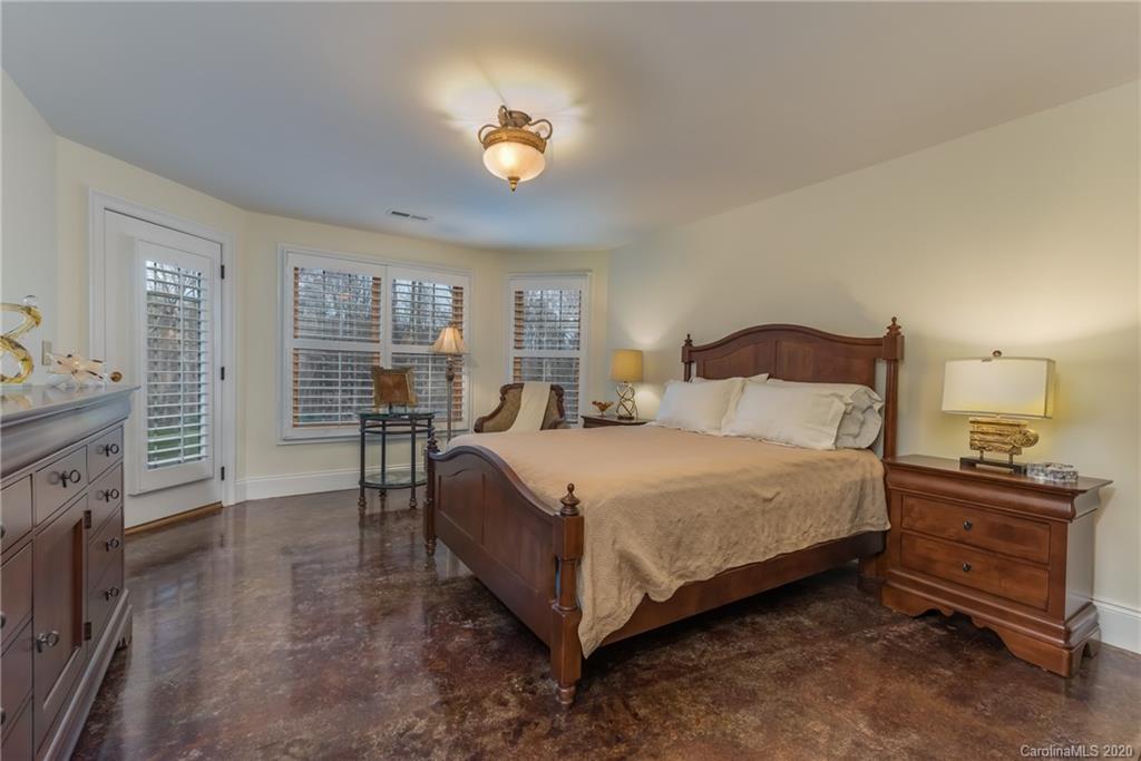 188 Timberlake Road Bostic, NC 28018 - Photo 36 of 48 a bedroom with a bed and a chandelier