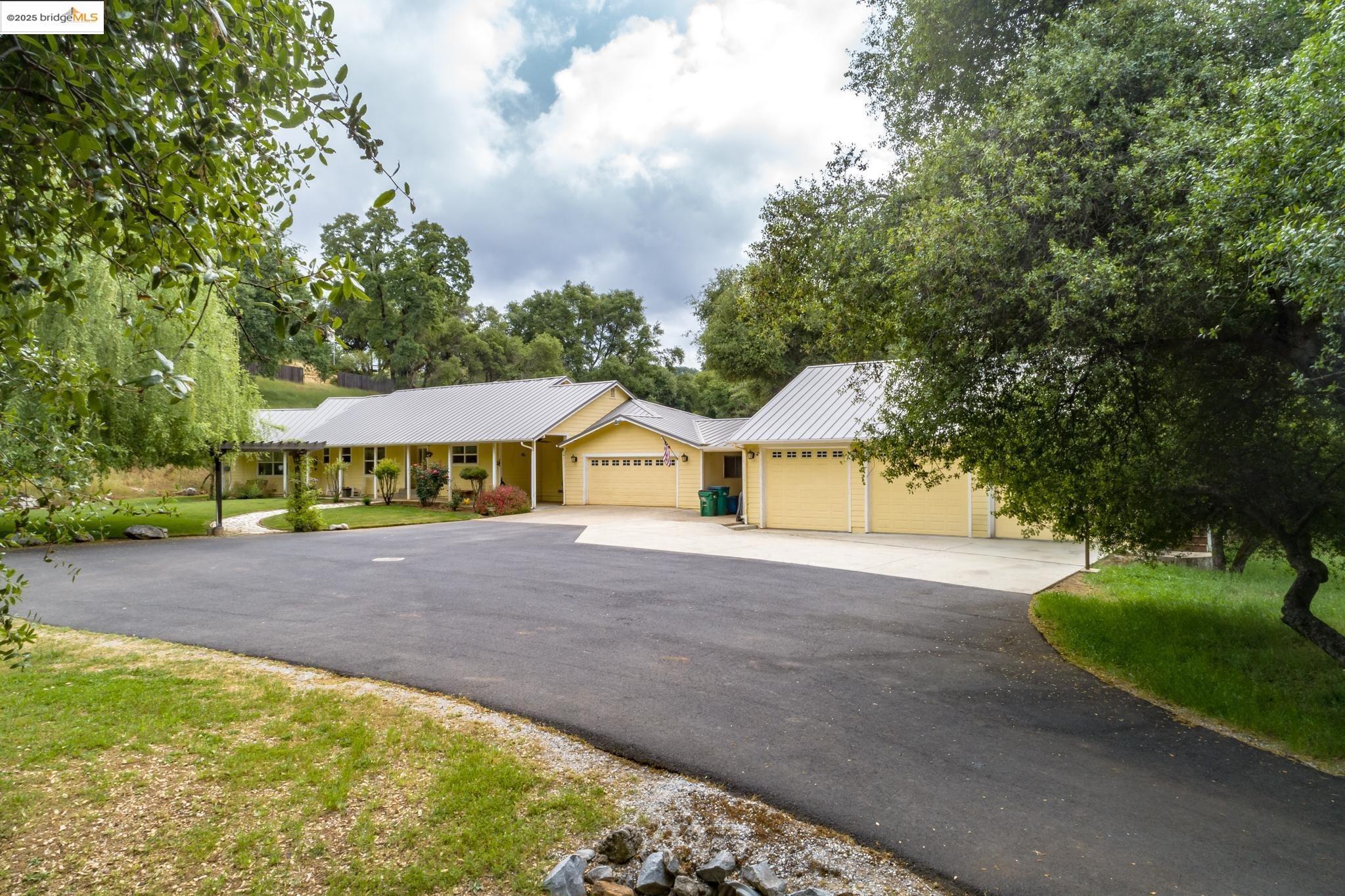 22979 Parrotts Ferry Road Columbia, CA 95310 - Photo 1 of 1 a view of a house with pool and yard