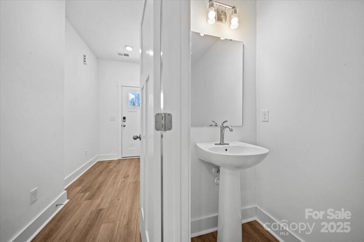 45 Moon Hvn Way Arden, NC 28704 - Photo 12 of 31 a bathroom with a sink and a mirror