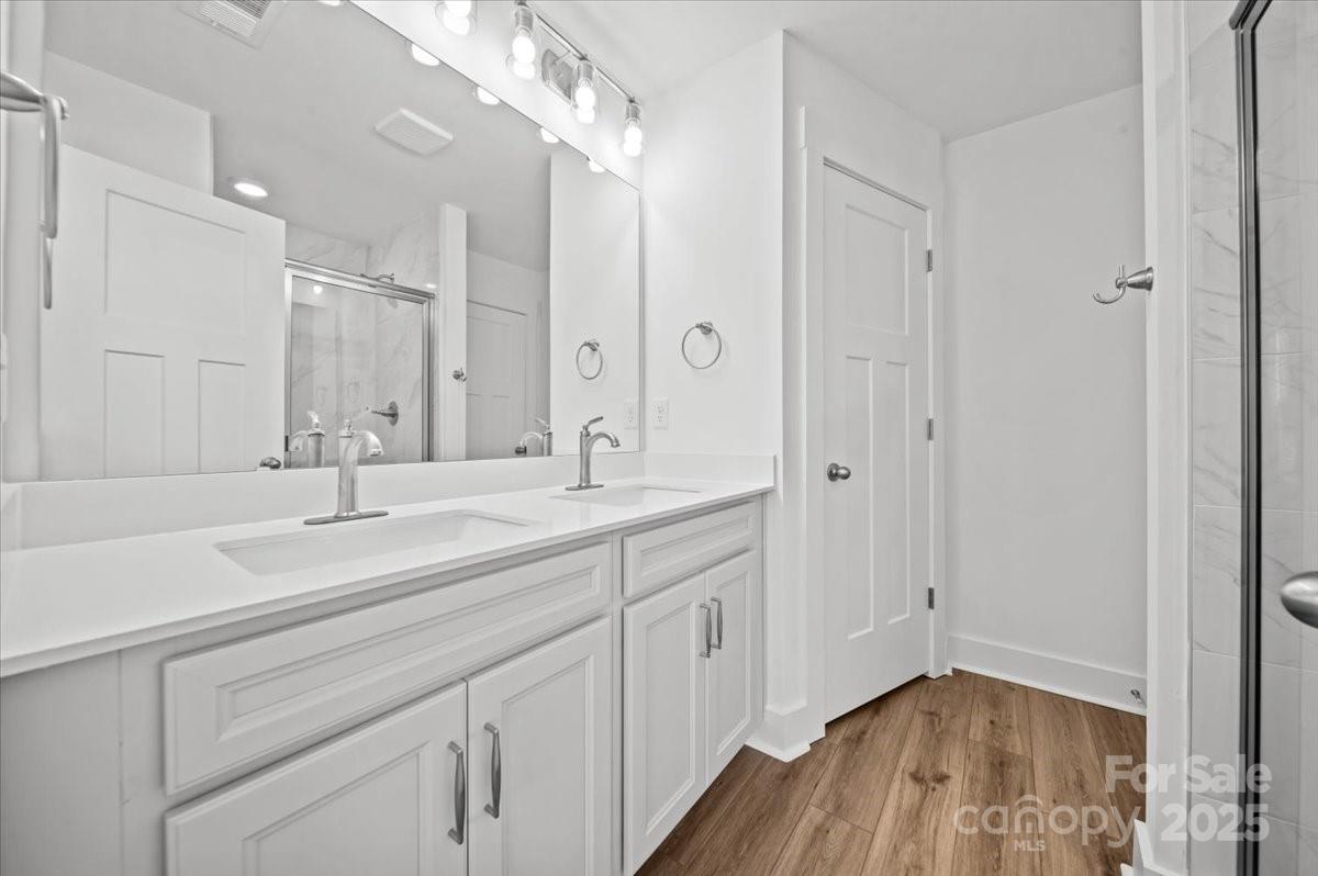 45 Moon Hvn Way Arden, NC 28704 - Photo 16 of 31 a bathroom with a double vanity sink and mirror