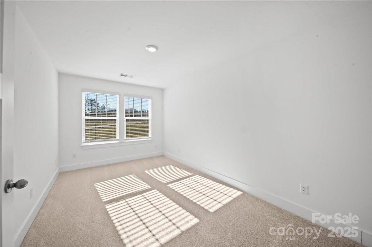 45 Moon Hvn Way Arden, NC 28704 - Photo 21 of 31 an empty room with a window