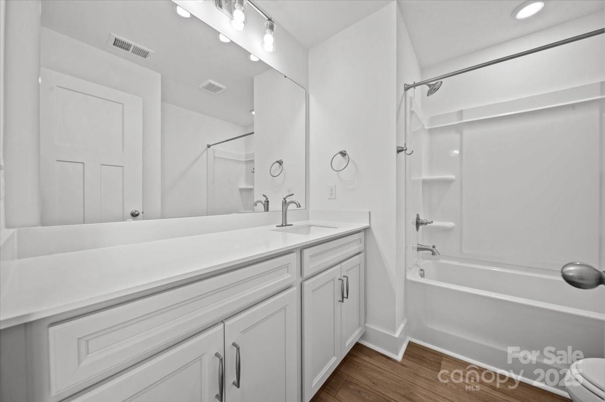 45 Moon Hvn Way Arden, NC 28704 - Photo 22 of 31 a bathroom with a tub sink and mirror