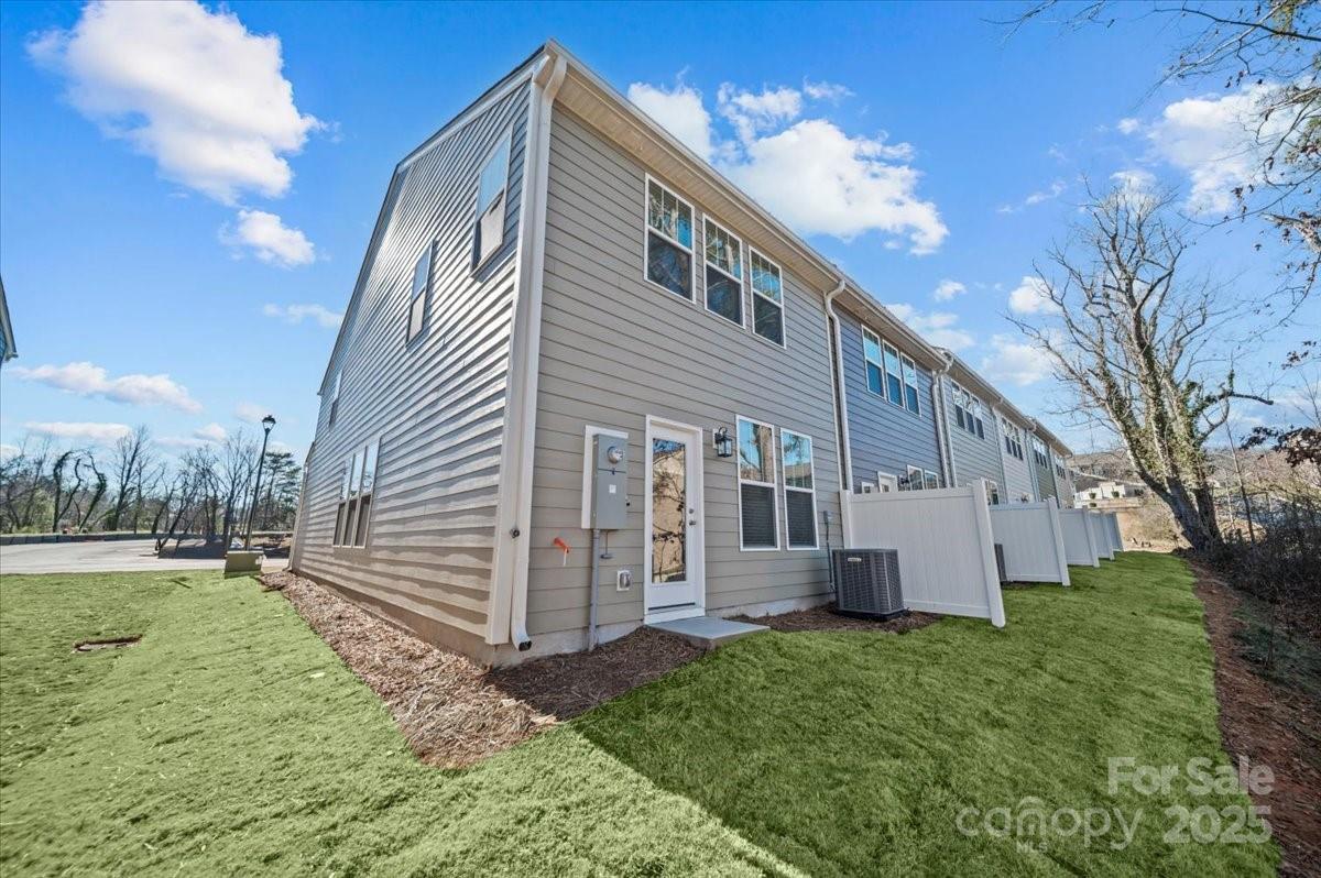45 Moon Hvn Way Arden, NC 28704 - Photo 25 of 31 a view of a house with backyard and a tree