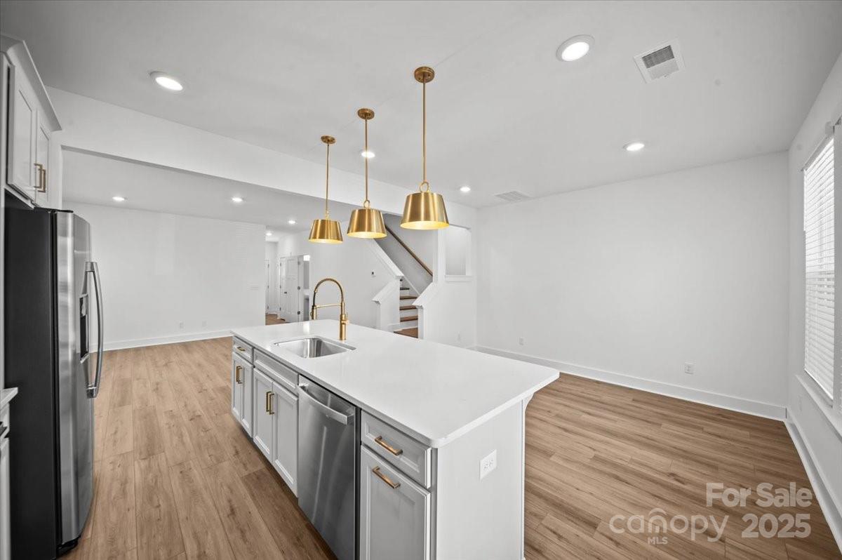 45 Moon Hvn Way Arden, NC 28704 - Photo 7 of 31 a kitchen with a sink and stove