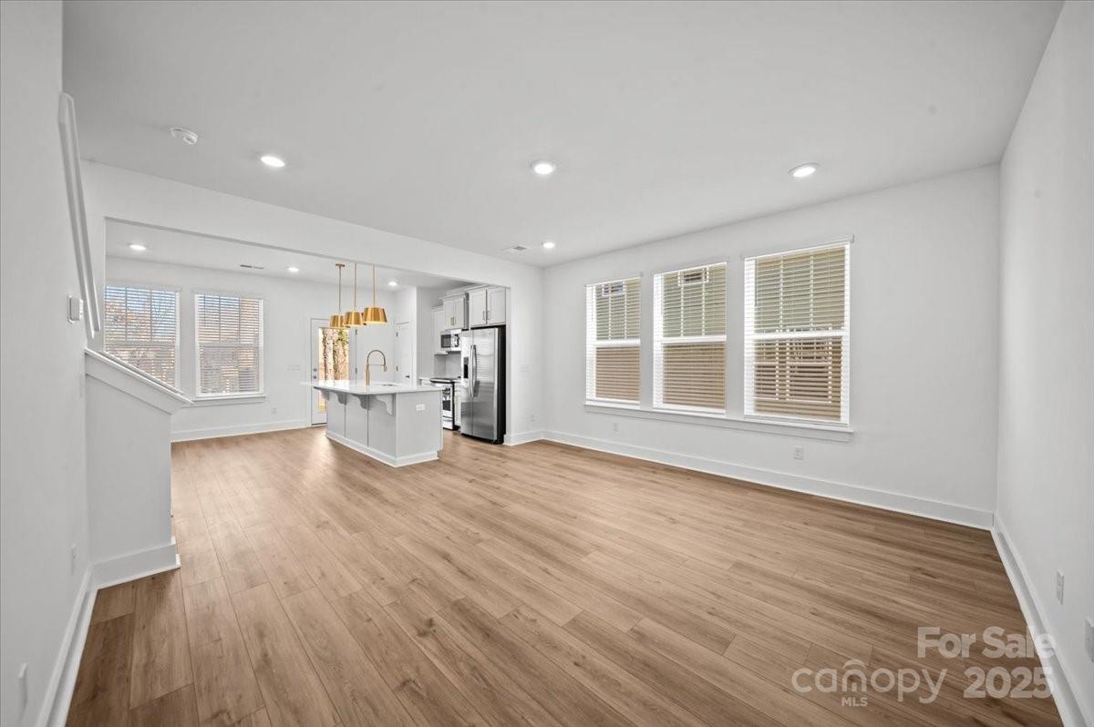 45 Moon Hvn Way Arden, NC 28704 - Photo 9 of 31 a view of empty room with wooden floor and windows