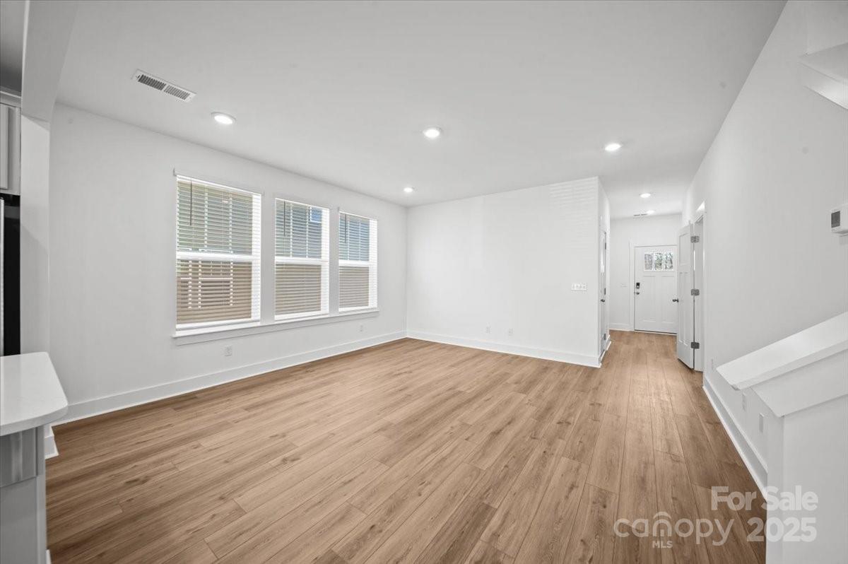 45 Moon Hvn Way Arden, NC 28704 - Photo 10 of 31 a view of empty room with wooden floor and windows