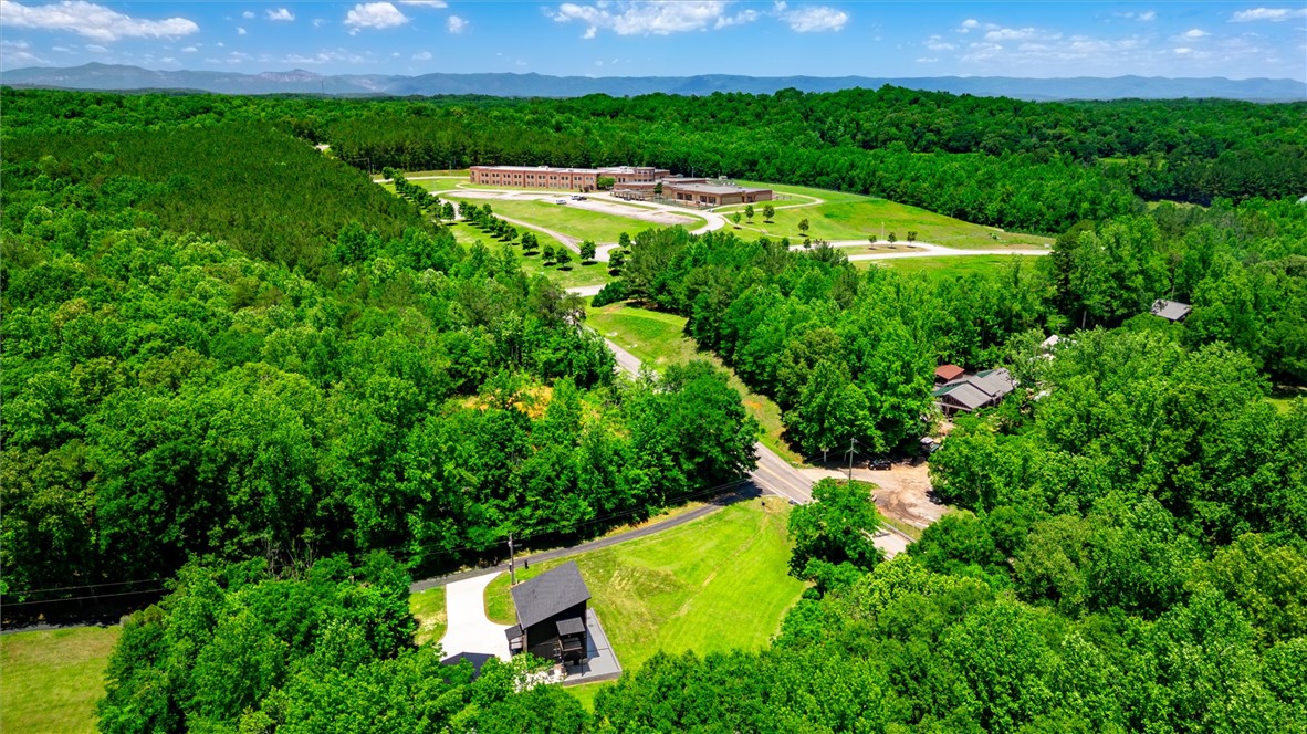 159 Cherokee Trail Easley, SC 29640 - Photo 33 of 38 A sprawling estate surrounded by abundant greenery, offering a serene, private setting.