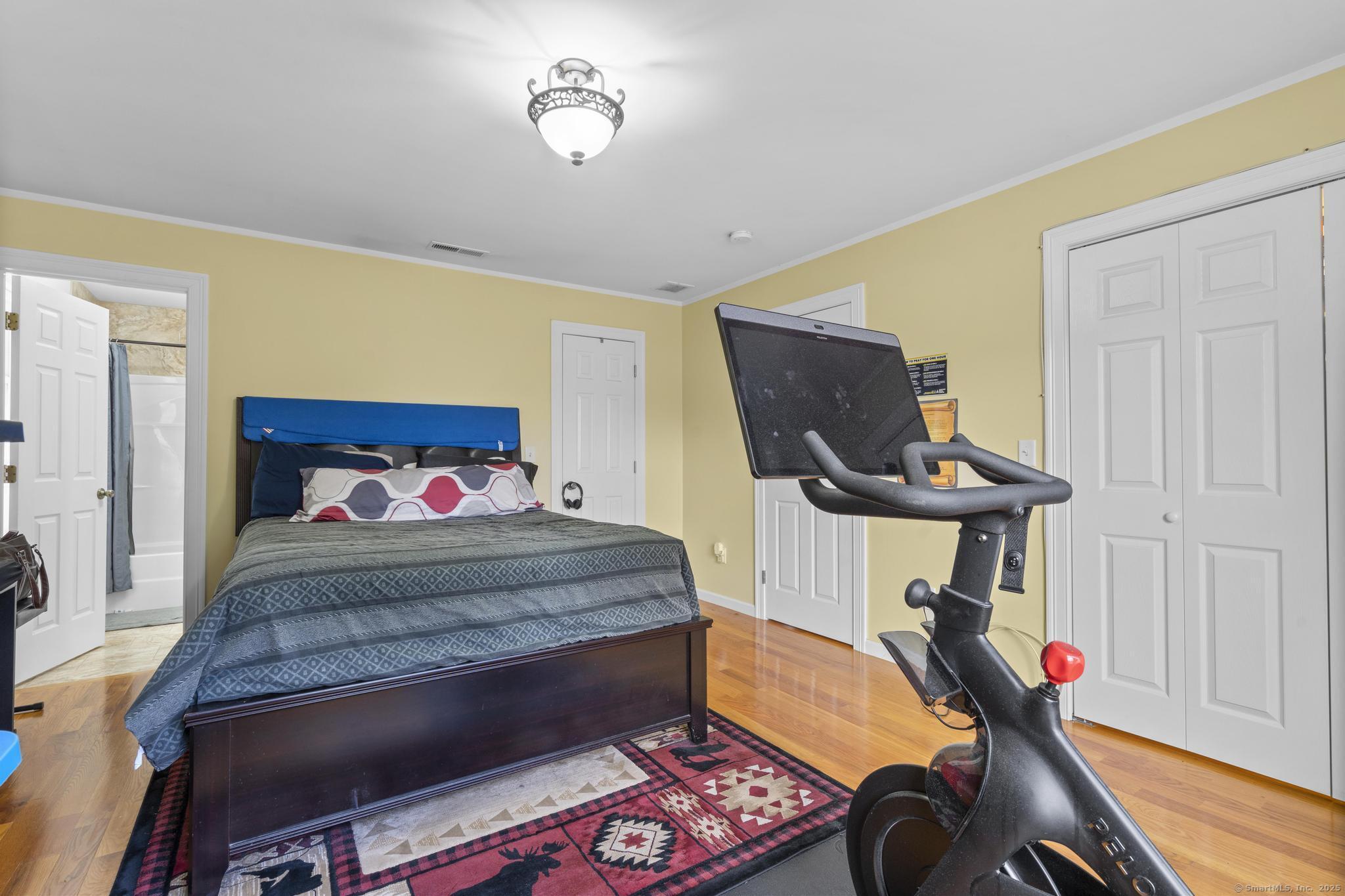 55 Allen Street New Britain, CT 06053 - Photo 33 of 40 a bedroom with a bed and wooden floor