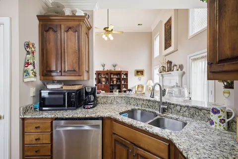 a bathroom with a granite countertop sink mirror bathtub and shower