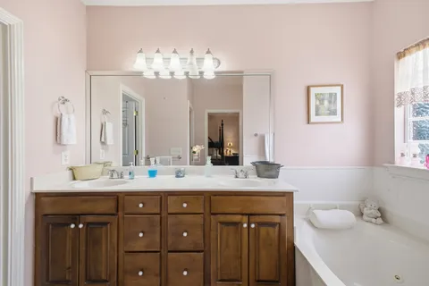 a view of a storage and utility room with washer and dryer