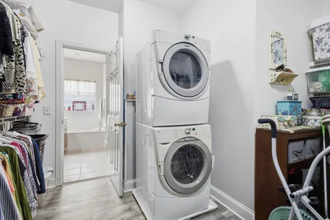 a bathroom with a granite countertop sink toilet a shower and a mirror