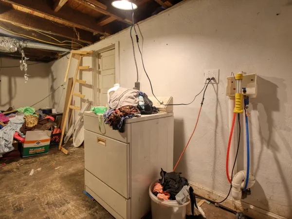a kitchen with a sink cabinets and window