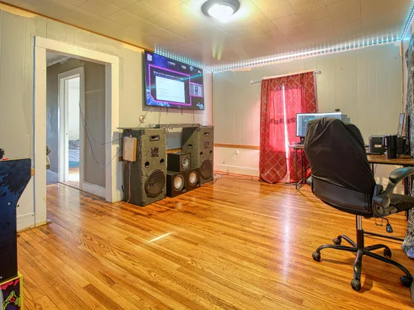 a view of a livingroom with furniture and a workspace