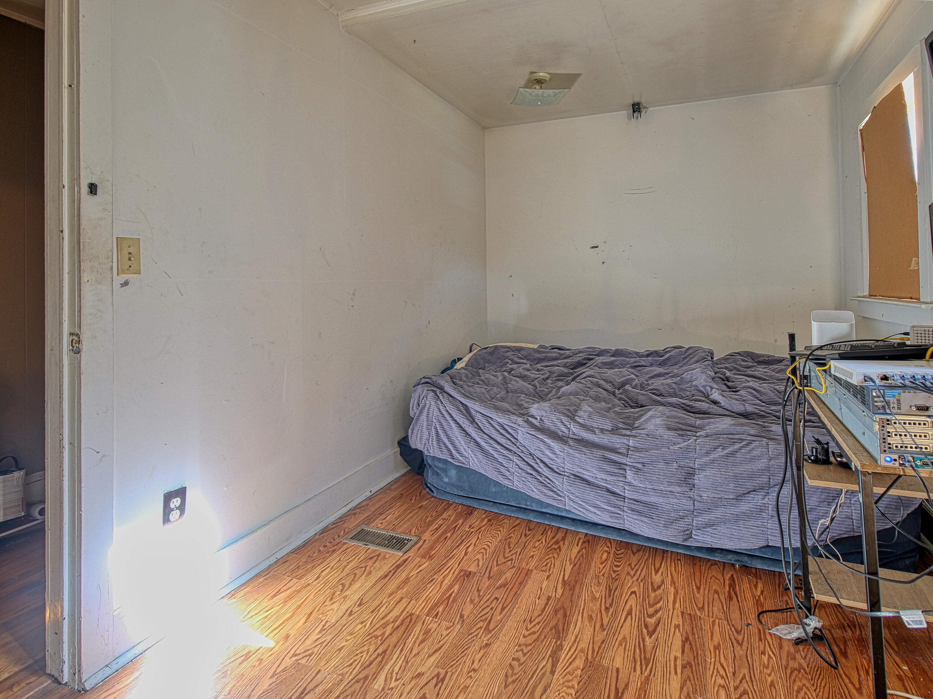 424 Magazine Street Pulaski, VA 24301 - Photo 7 of 18 a bedroom with a bed and a window