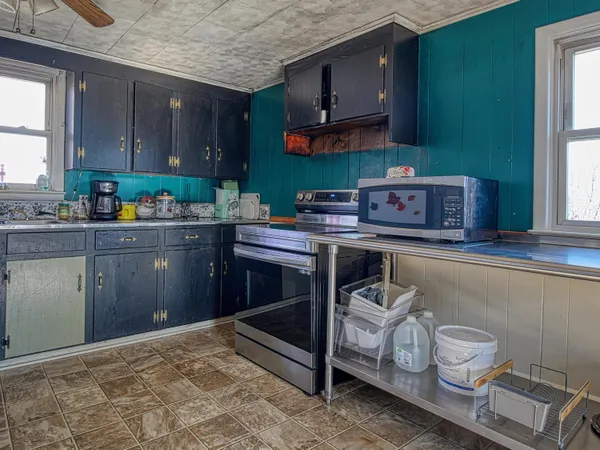 a kitchen with a stove and a microwave