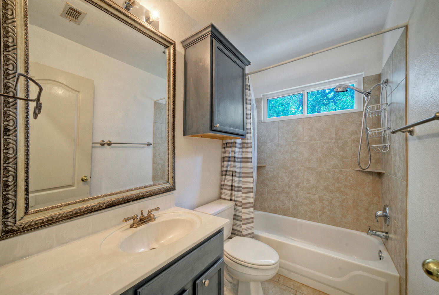 4518 Tello Path Austin, TX 78749 - Photo 20 of 26 Bathroom featuring vanity and shower / bathtub combination with curtain