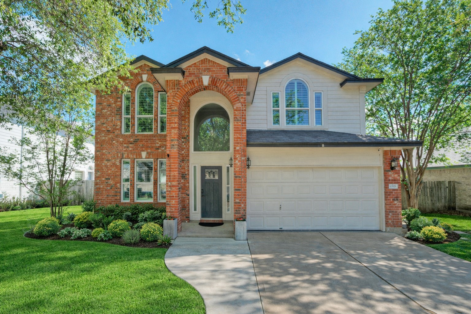 4518 Tello Path Austin, TX 78749 - Photo 2 of 26 View of front of property with a garage, concrete driveway, and brick siding