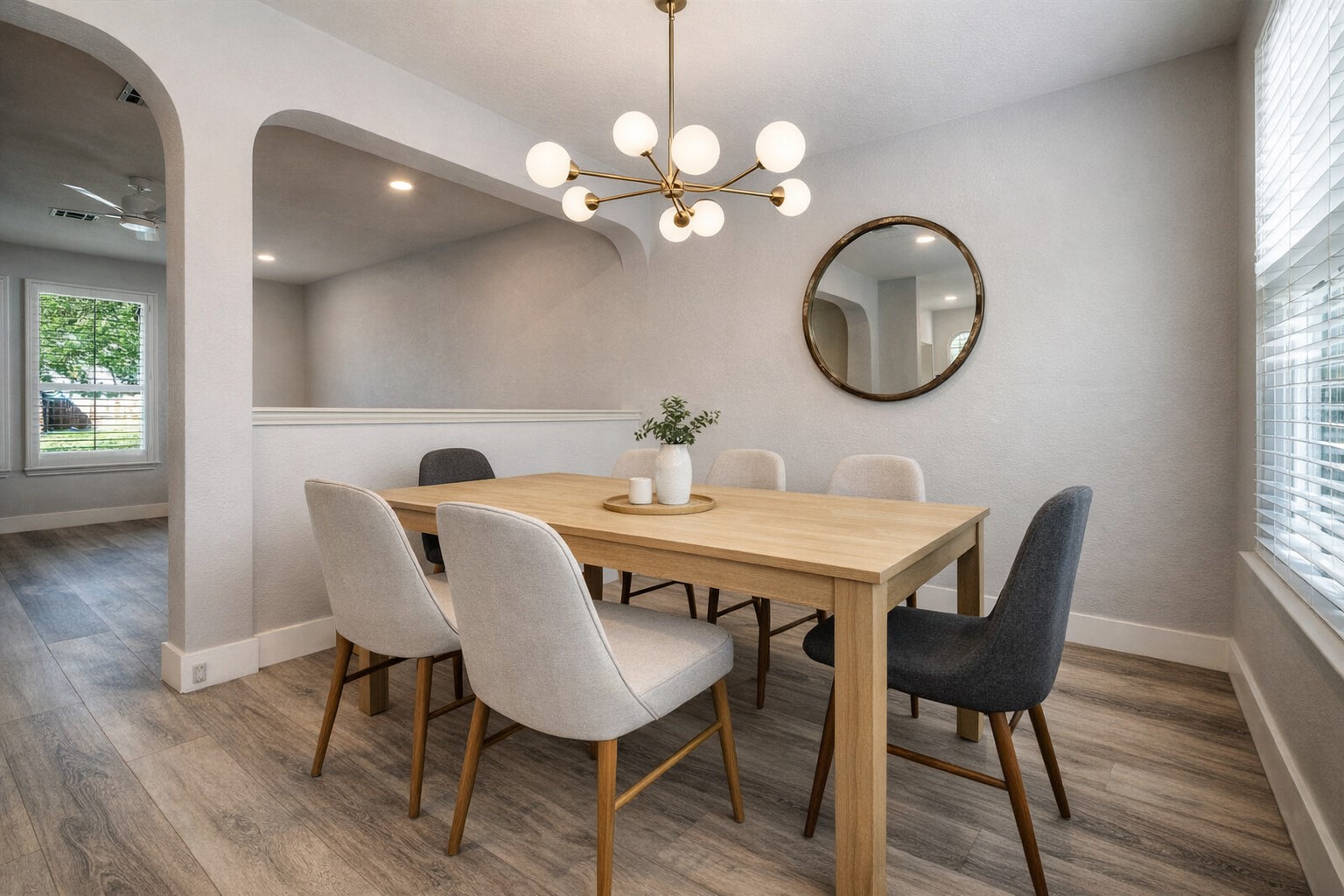 4518 Tello Path Austin, TX 78749 - Photo 5 of 26 Ai - Dining room with wood finished floors, hanging lights, arched walkways, and a ceiling fan