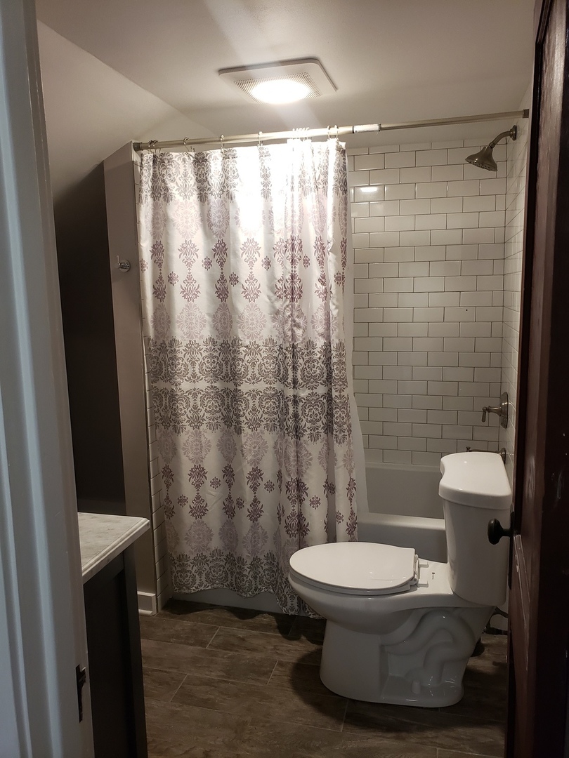 1917 Cedar Road Homewood, IL 60430 - Photo 12 of 20 a bathroom with a toilet and a shower