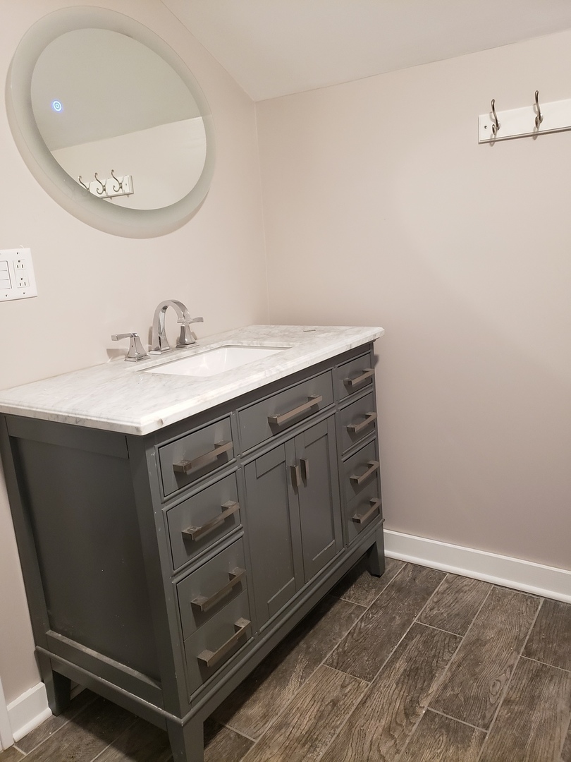 1917 Cedar Road Homewood, IL 60430 - Photo 13 of 20 a bathroom with a sink and a mirror