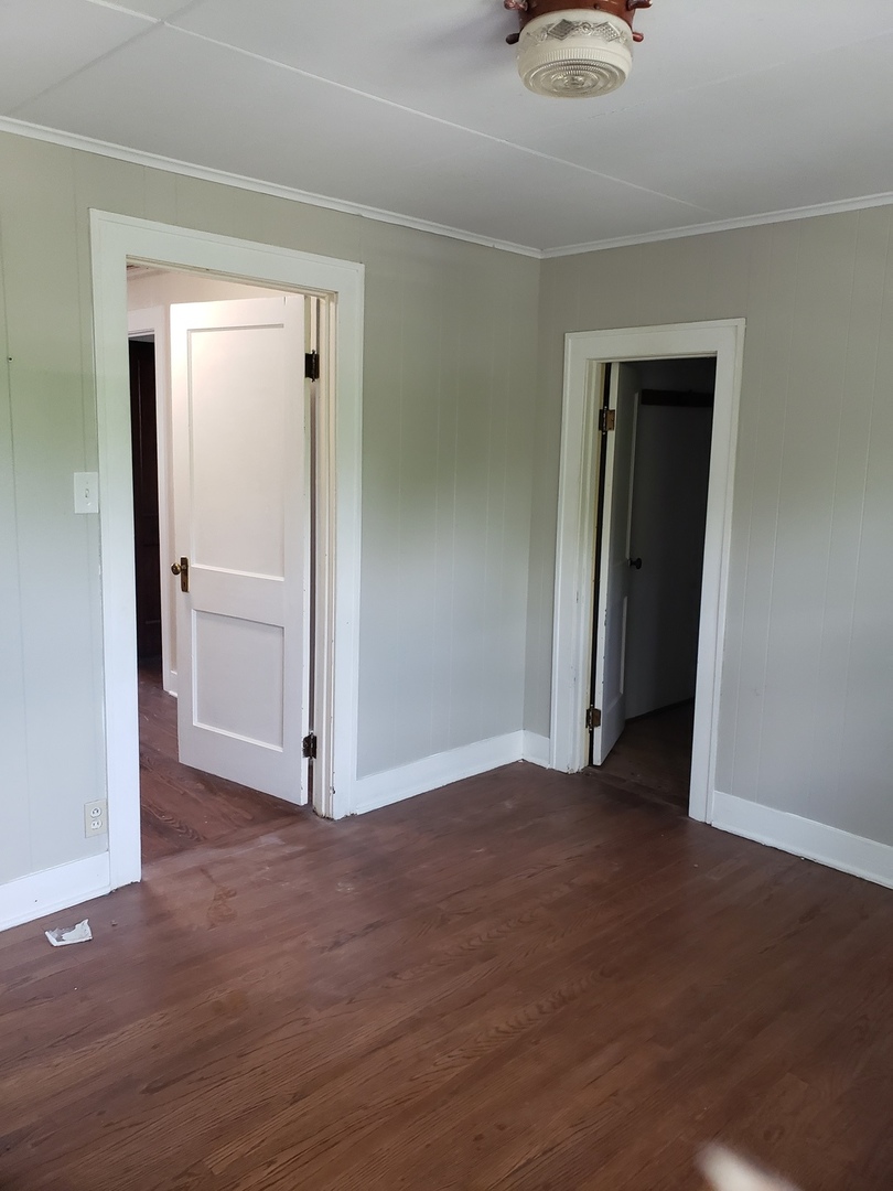 1917 Cedar Road Homewood, IL 60430 - Photo 14 of 20 a view of a livingroom with wooden floor and closet
