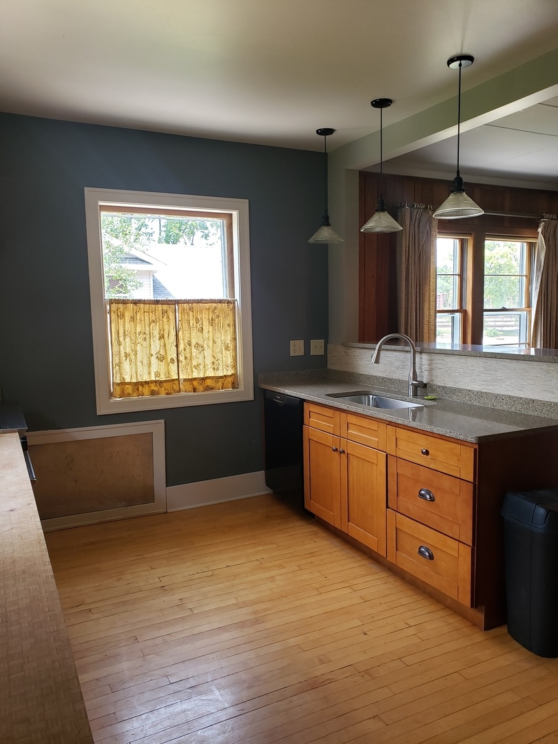 1917 Cedar Road Homewood, IL 60430 - Photo 7 of 20 a kitchen with granite countertop a sink window and a counter top space