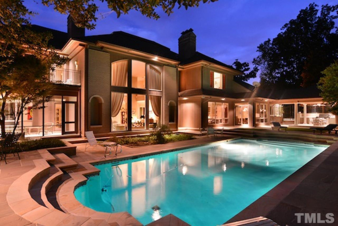 a view of a house with swimming pool