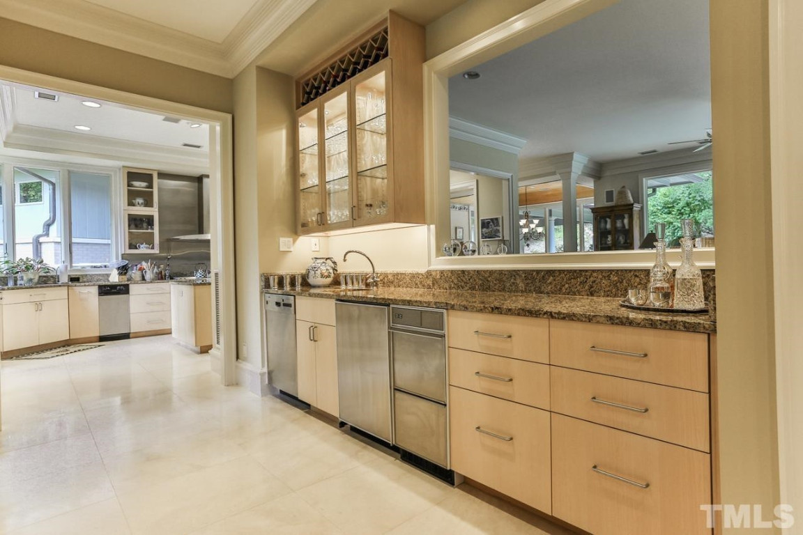 24107 Cherry Drive Chapel Hill, NC 27517 - Photo 14 of 46 a living room with granite countertop white cabinets and stainless steel appliances