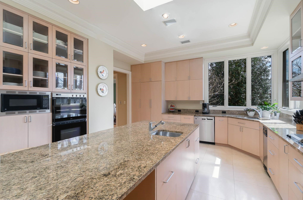 24107 Cherry Drive Chapel Hill, NC 27517 - Photo 17 of 46 a kitchen with a stove a sink and a refrigerator