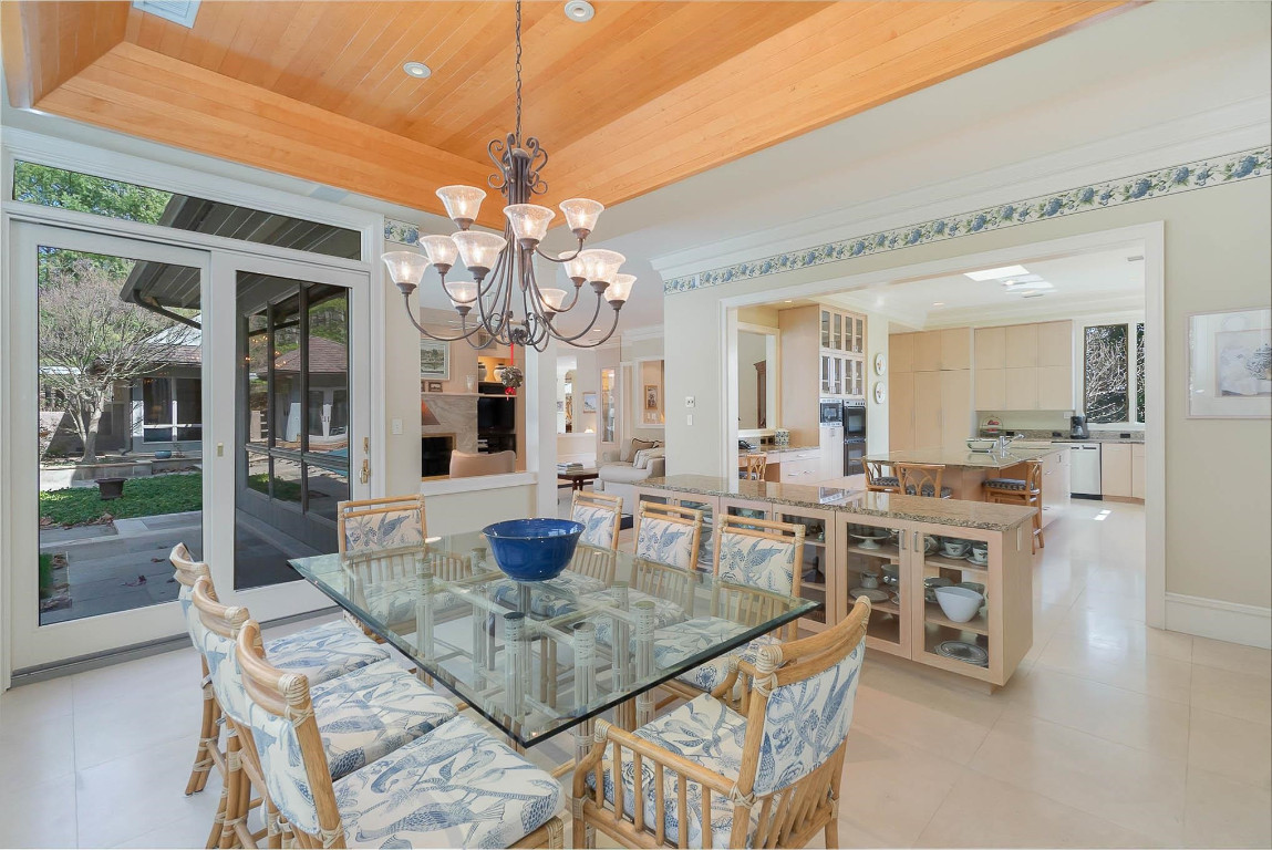 24107 Cherry Drive Chapel Hill, NC 27517 - Photo 19 of 46 a view of a dining room with furniture wooden floor and chandelier