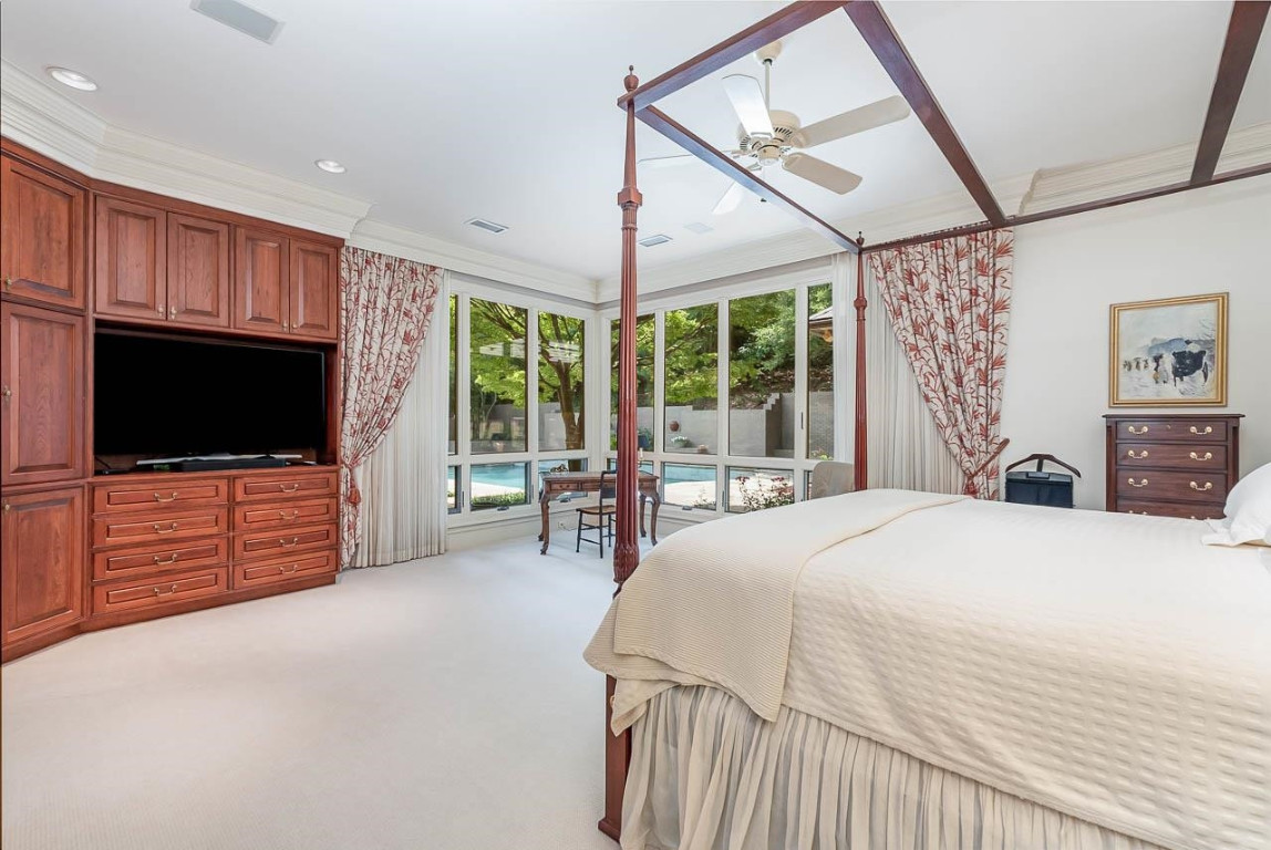 24107 Cherry Drive Chapel Hill, NC 27517 - Photo 27 of 46 a bedroom with furniture and flat screen tv
