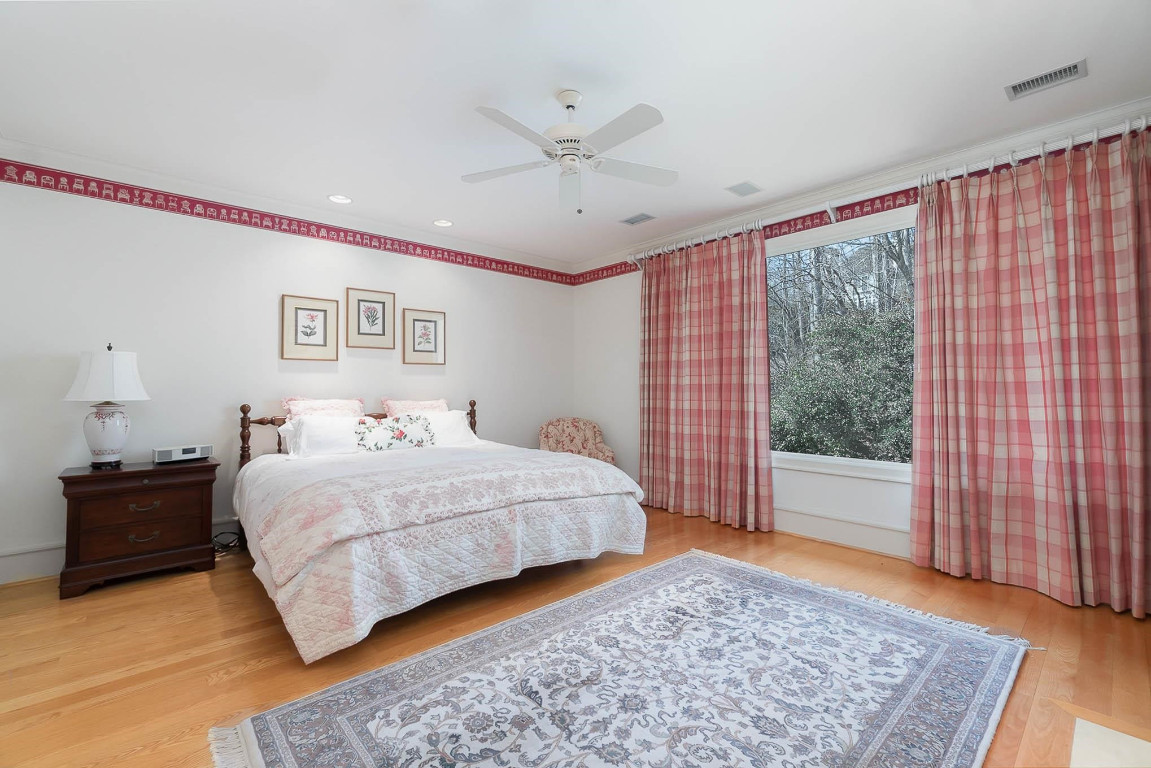 24107 Cherry Drive Chapel Hill, NC 27517 - Photo 34 of 46 a bedroom with a large bed and a window