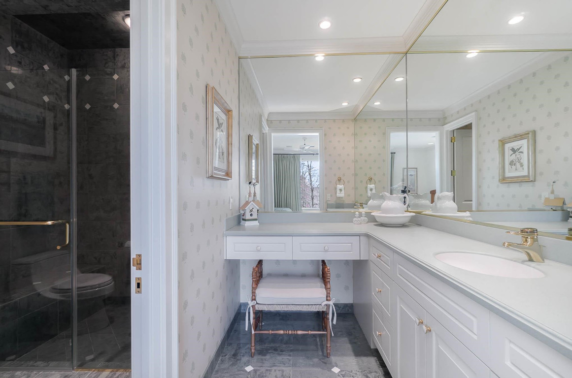 24107 Cherry Drive Chapel Hill, NC 27517 - Photo 38 of 46 a bathroom with a sink shower and a mirror